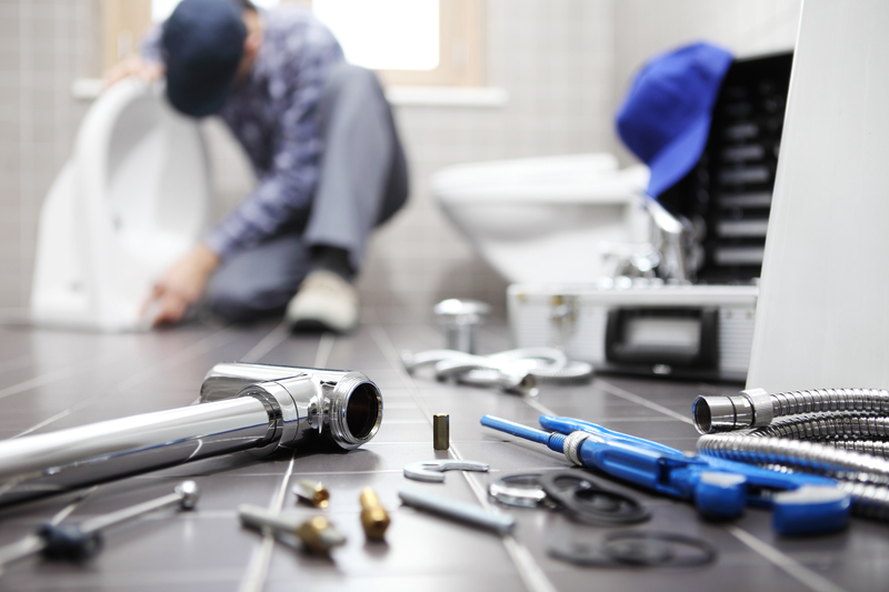 plumber at work in a bathroom