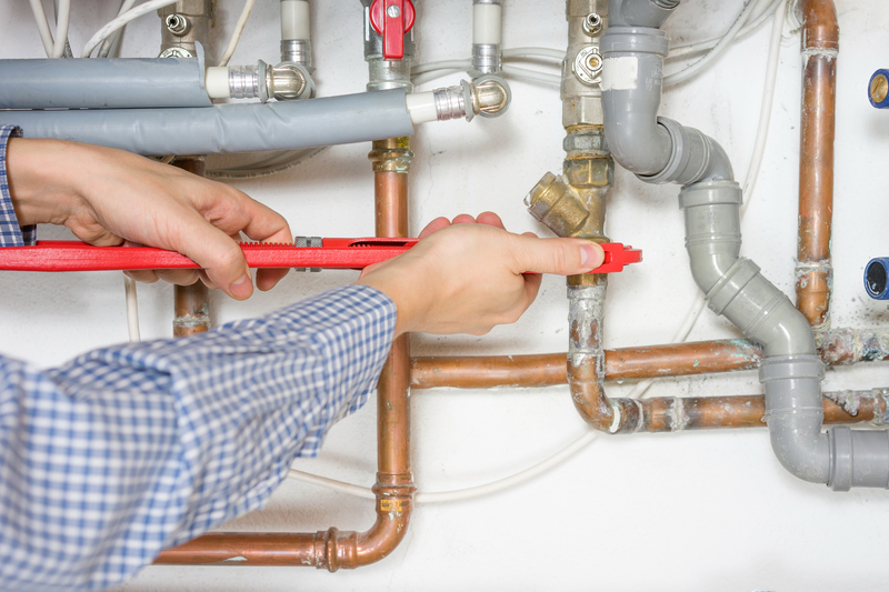 plumber fixing central heating system